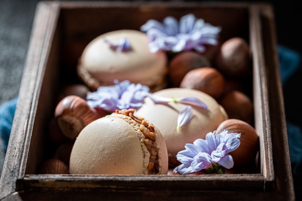 Delicious hazelnut macaroons in dark wooden box